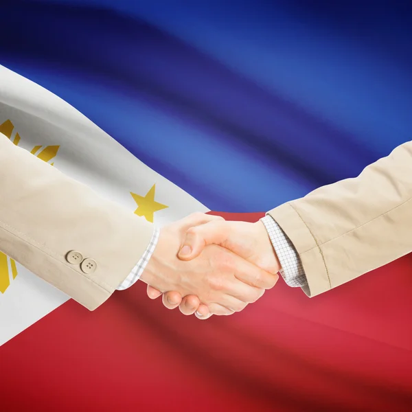 Apretón de manos de empresarios con bandera sobre fondo - Filipinas — Foto de Stock