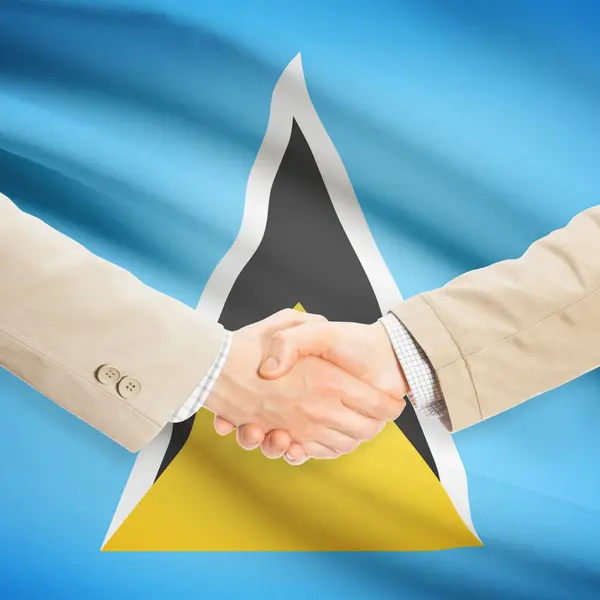 Zakenlieden handdruk met vlag op achtergrond - Saint Lucia — Stockfoto