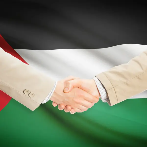 Επιχειρηματίες χειραψία με σημαία σε φόντο - Παλαιστίνη — Φωτογραφία Αρχείου