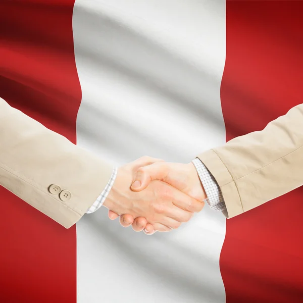 背景 - ペルーの旗とビジネスマン握手 — ストック写真