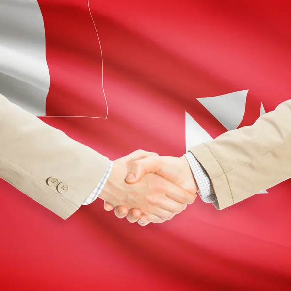 Unternehmer-Handshakes mit Flagge auf Hintergrund - Wallis und Futun — Stockfoto