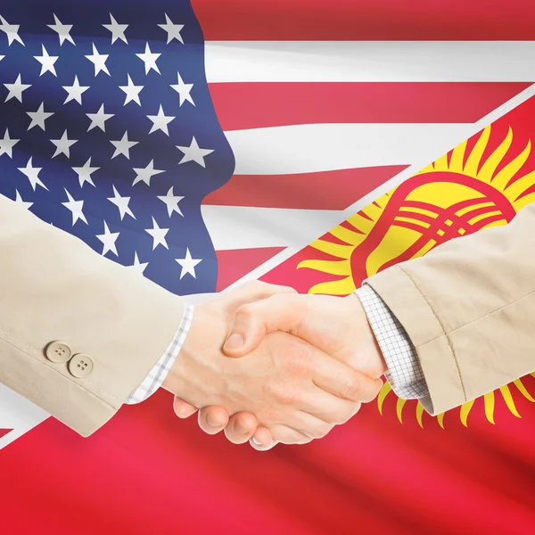 Apretón de manos de hombres de negocios - Estados Unidos y Kirguistán — Foto de Stock