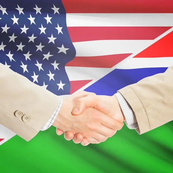 Podnikatelé handshake - USA a Gambie — Stock fotografie