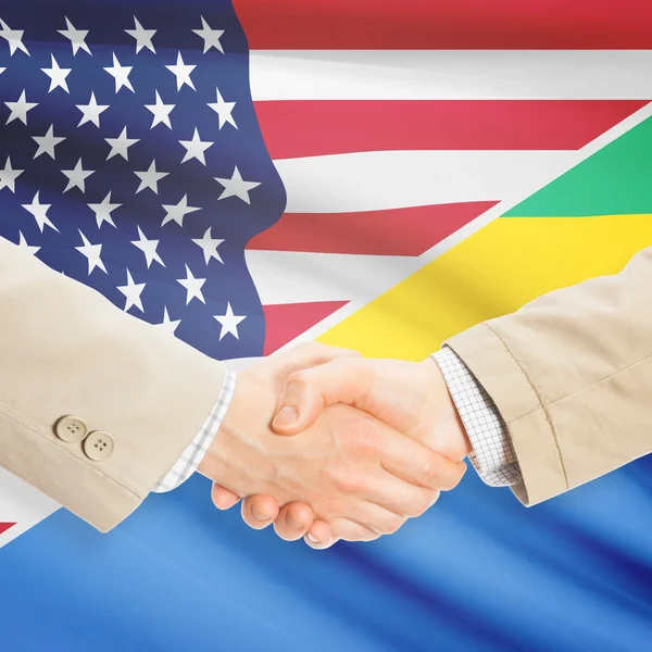 Podnikatelé handshake - USA a Gabon — Stock fotografie