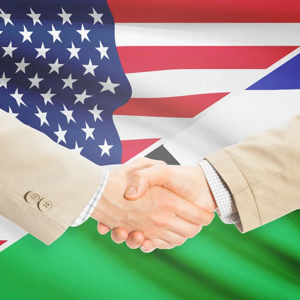 Podnikatelé handshake - USA a Lesotho — Stock fotografie