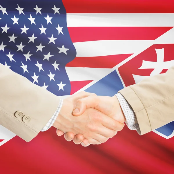 Businessmen handshake - United States and Slovakia — Stock Photo, Image