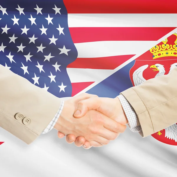 Businessmen handshake - United States and Serbia — Stock Photo, Image
