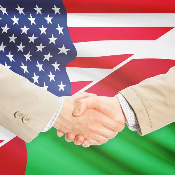 Unternehmer-Handshake - USA und Oman — Stockfoto