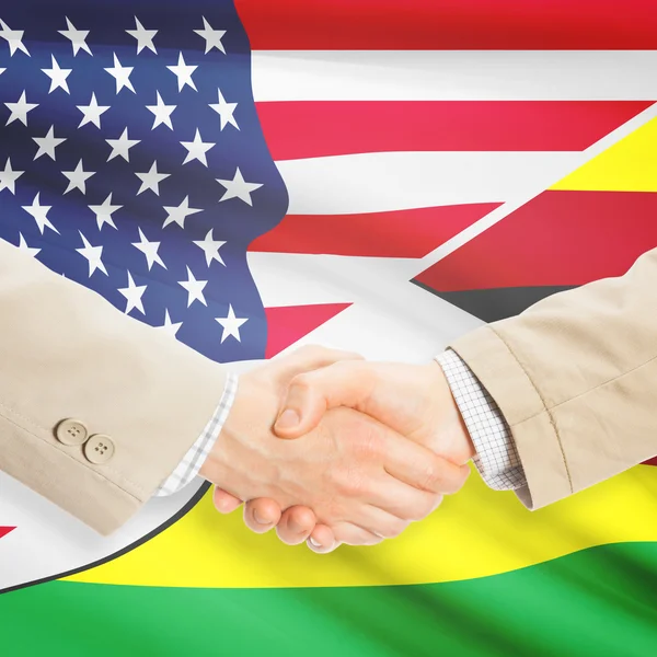 Businessmen handshake - United States and Zimbabwe — Stock Photo, Image