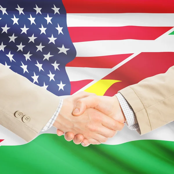 Podnikatelé handshake - USA a Surinamu — Stock fotografie