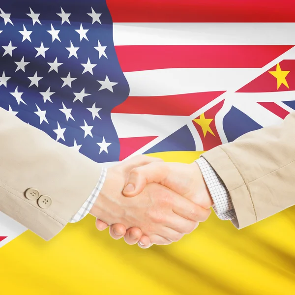 Businessmen handshake - United States and Niue — Stock Photo, Image