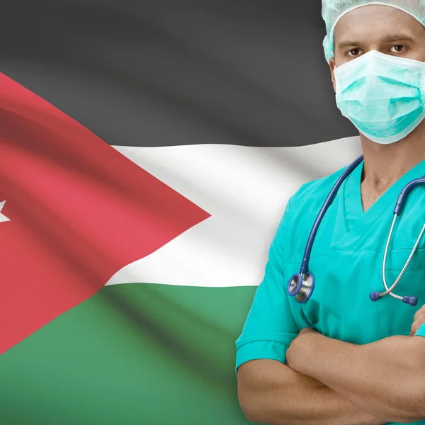 Хирург с флагом на фоне серии - Jordan — стоковое фото