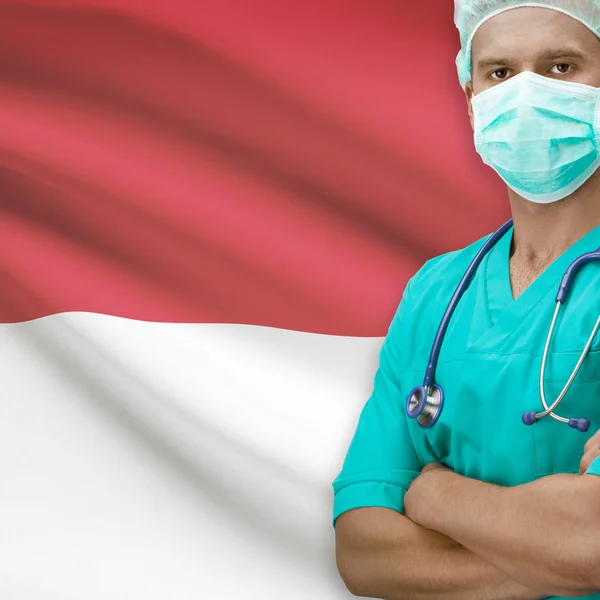 Хирург с флагом на фоне серии - Монако — стоковое фото
