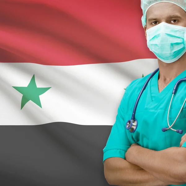 Хирург с флагом на фоне серии - Сирия — стоковое фото
