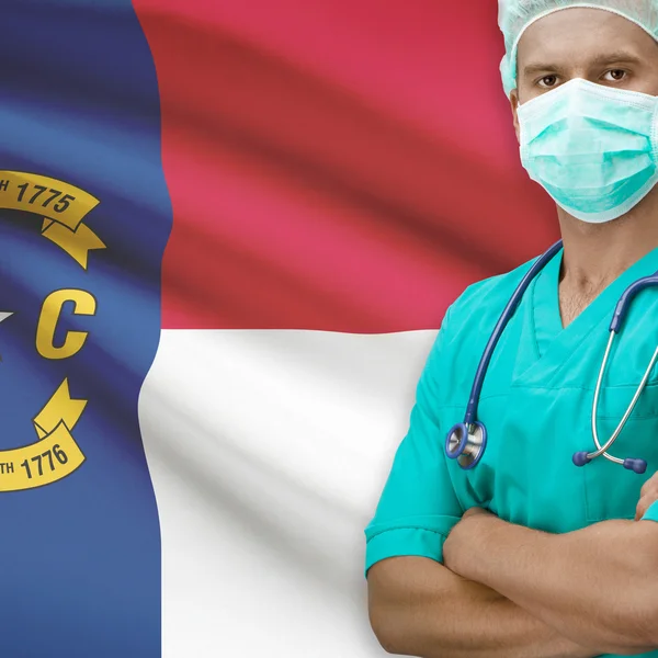 Surgeon with US states flags on background series - North Caroli — Stock Photo, Image
