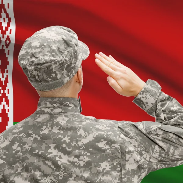 Soldier in hat facing national flag series - Belarus — Stock Photo, Image
