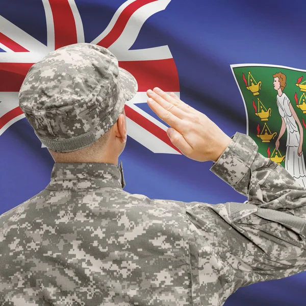 Soldier in hat facing national flag series - British Virgin Isla — Stock Photo, Image