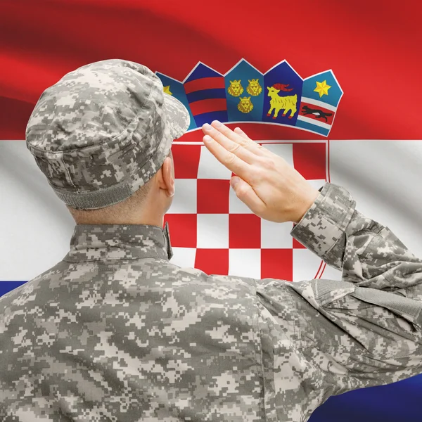 Soldier in hat facing national flag series - Croatia — Stock Photo, Image