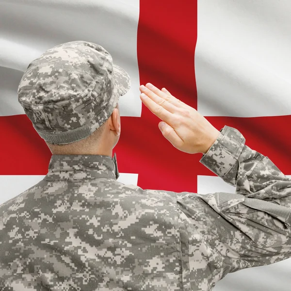 Soldier in hat facing national flag series - England — Stock Photo, Image