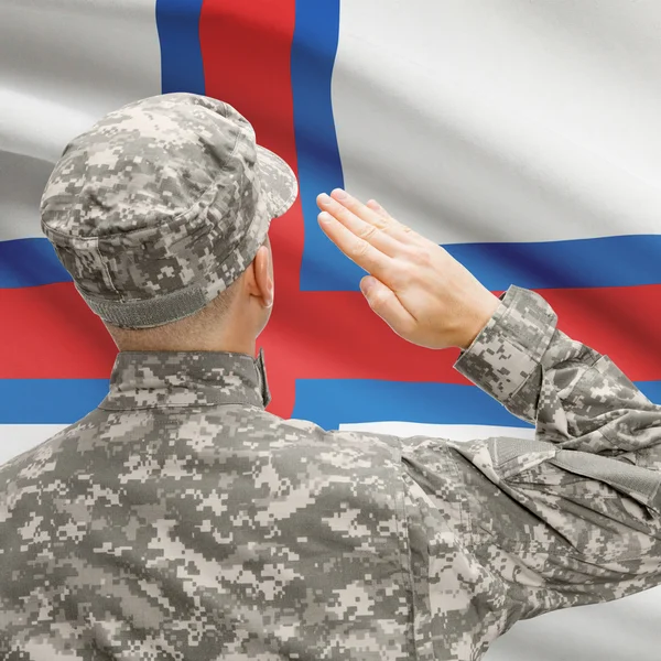 Soldier in hat facing national flag series - Faroe Islands — Stock Photo, Image