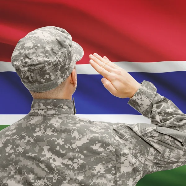 Soldier in hat facing national flag series - Gambia — Stock Photo, Image