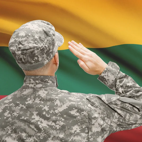 Soldier in hat facing national flag series - Lithuania — Stock Photo, Image