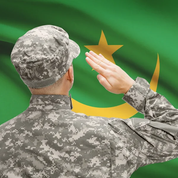 Soldier in hat facing national flag series - Mauritania — Stock Photo, Image