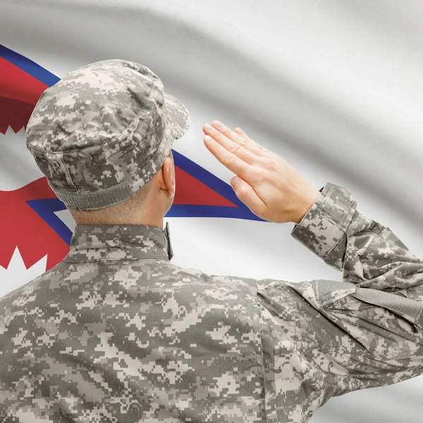 stock image Soldier in hat facing national flag series - Nepal