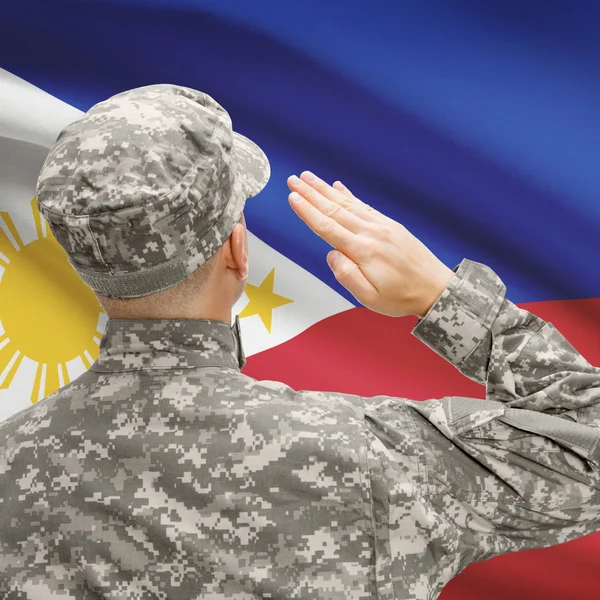 Soldier in hat facing national flag series - Philippines — Stock Photo, Image