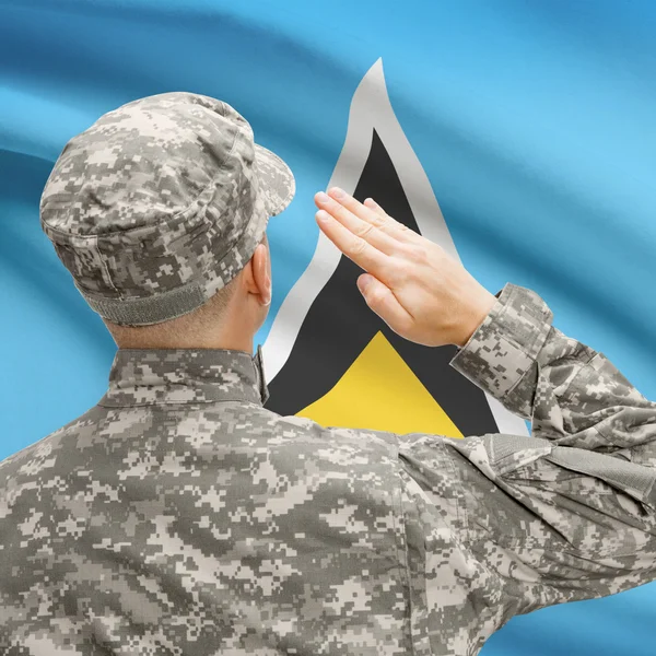 Żołnierz w kapeluszu w obliczu flagi narodowej serii - Saint Lucia — Zdjęcie stockowe