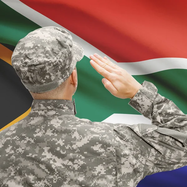 Soldier in hat facing national flag series - South Africa — Stock Photo, Image