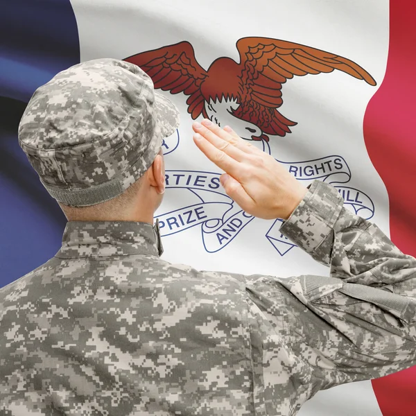 Soldier saluting to US state flag series - Iowa — Stock Photo, Image