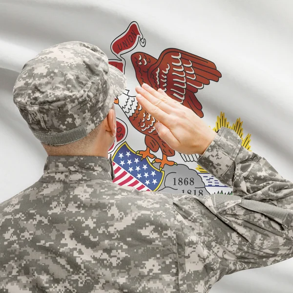 Солдат, салютование нам государства флага серии - Иллинойс — стоковое фото