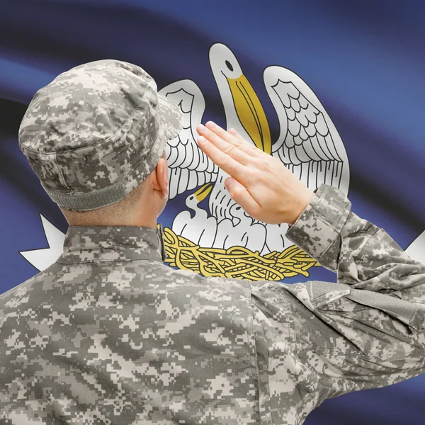 Soldier saluting to US state flag series - Louisiana — Stock Photo, Image