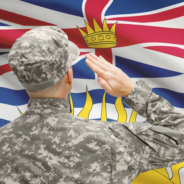 Soldier saluting to Canadial province flag series - British Colu — Stock Photo, Image