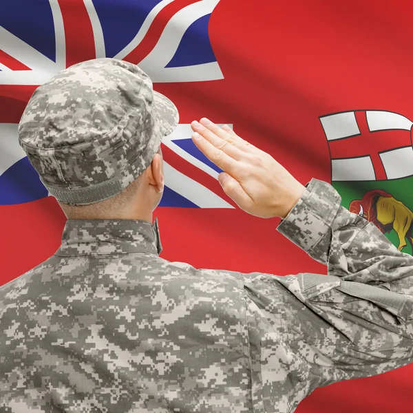 Soldier saluting to Canadial province flag series - Manitoba — Stock Photo, Image