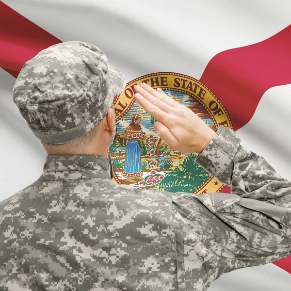 Soldier saluting to US state flag series - Florida — Stock Photo, Image