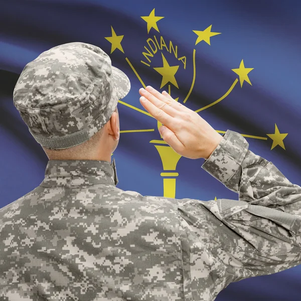 Soldier saluting to US state flag series - Indiana — Stock Photo, Image