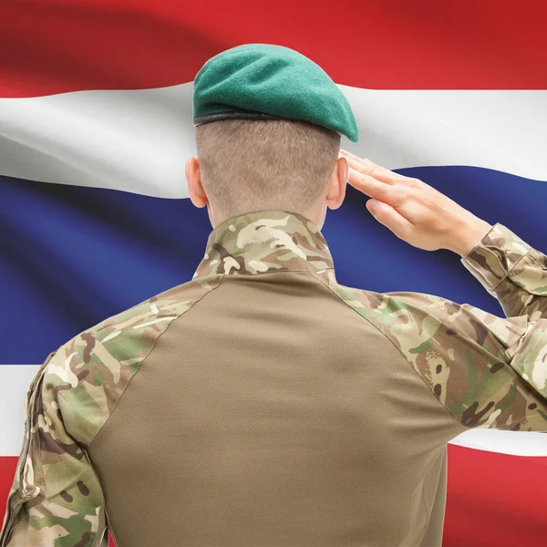 National military forces with flag on background conceptual seri — Stock fotografie