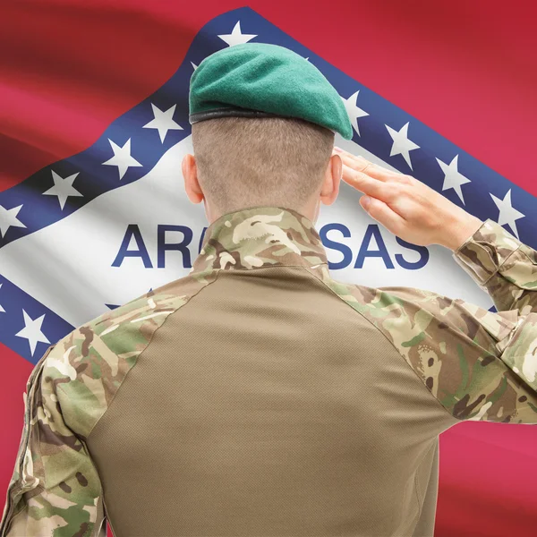Soldier saluting to USA state flag conceptual series - Arkansas — Stock Photo, Image