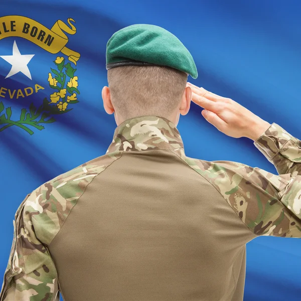 Soldier saluting to USA state flag conceptual series - Nevada — Stock Photo, Image