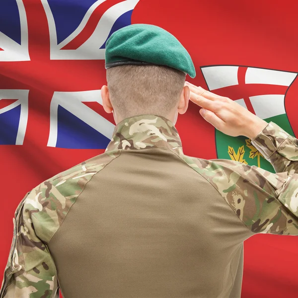 Soldier saluting to Canadial province flag conceptual series - O — Stockfoto