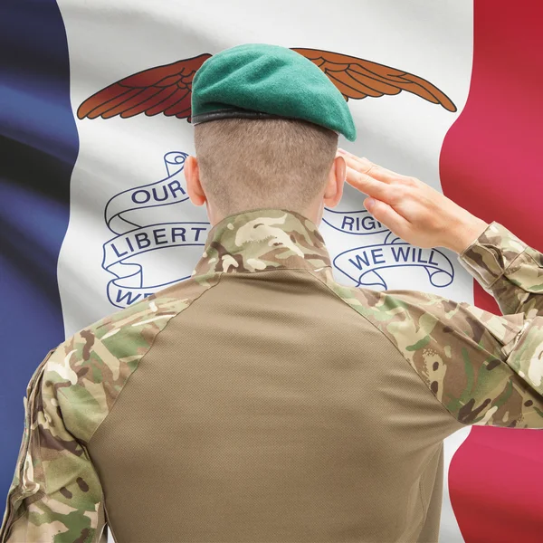 Soldier saluting to USA state flag conceptual series - Iowa — Stock Photo, Image