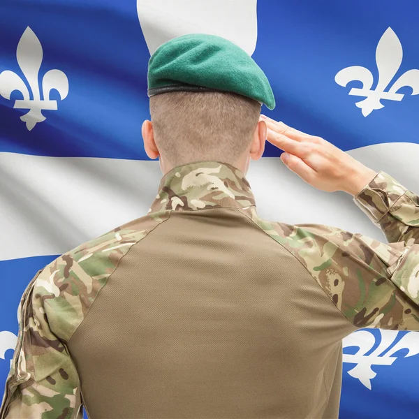 Soldier saluting to Canadial province flag conceptual series - Q — Stock Photo, Image