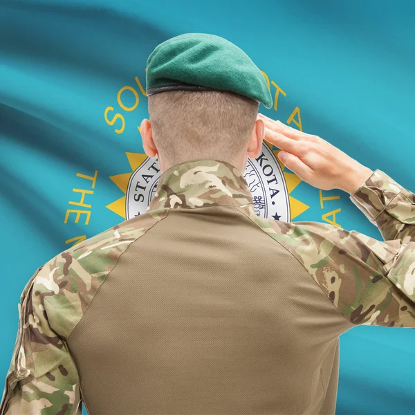 Soldier saluting to USA state flag conceptual series - South Dak — Stock Photo, Image