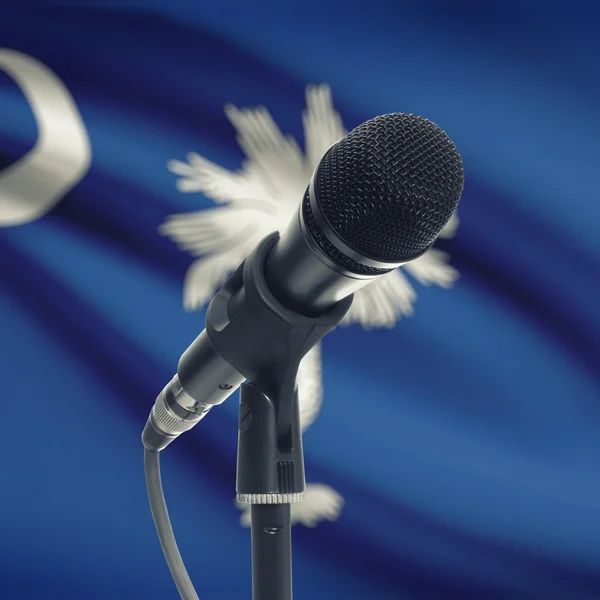 Microphone on stand with US state flag on background - South Car — Stockfoto