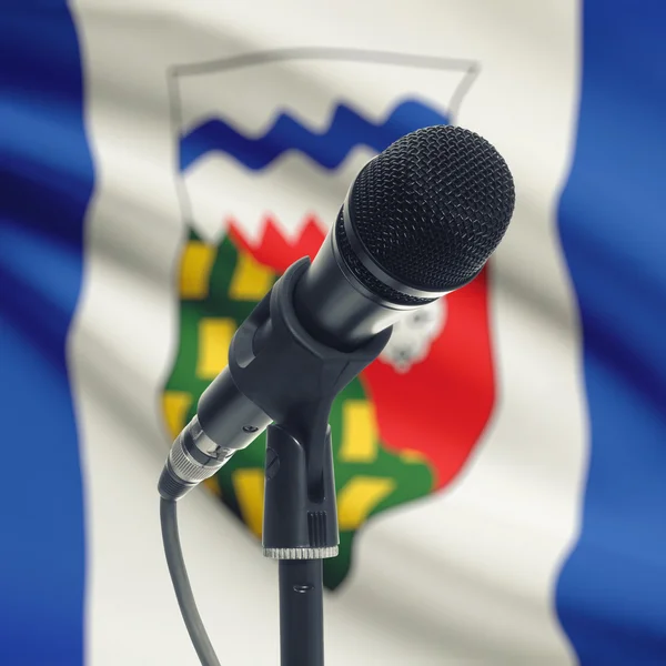 Microphone on stand with Canadian province flag on background - — Stockfoto
