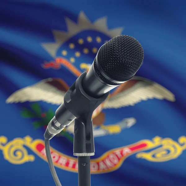 Microphone on stand with US state flag on background - North Dak — Zdjęcie stockowe