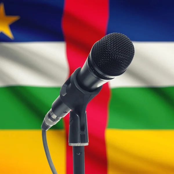 Microphone on stand with national flag on background - Central A — Φωτογραφία Αρχείου