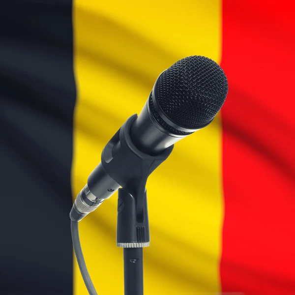 Microphone on stand with national flag on background - Belgium — Stock Photo, Image